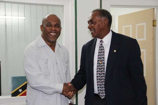Premier of Nevis (r) welcomes Leader of Government St. Eustatius Mr. Clyde Van Putten to his Bath Hotel office during a courtesy call on July 22, 2015